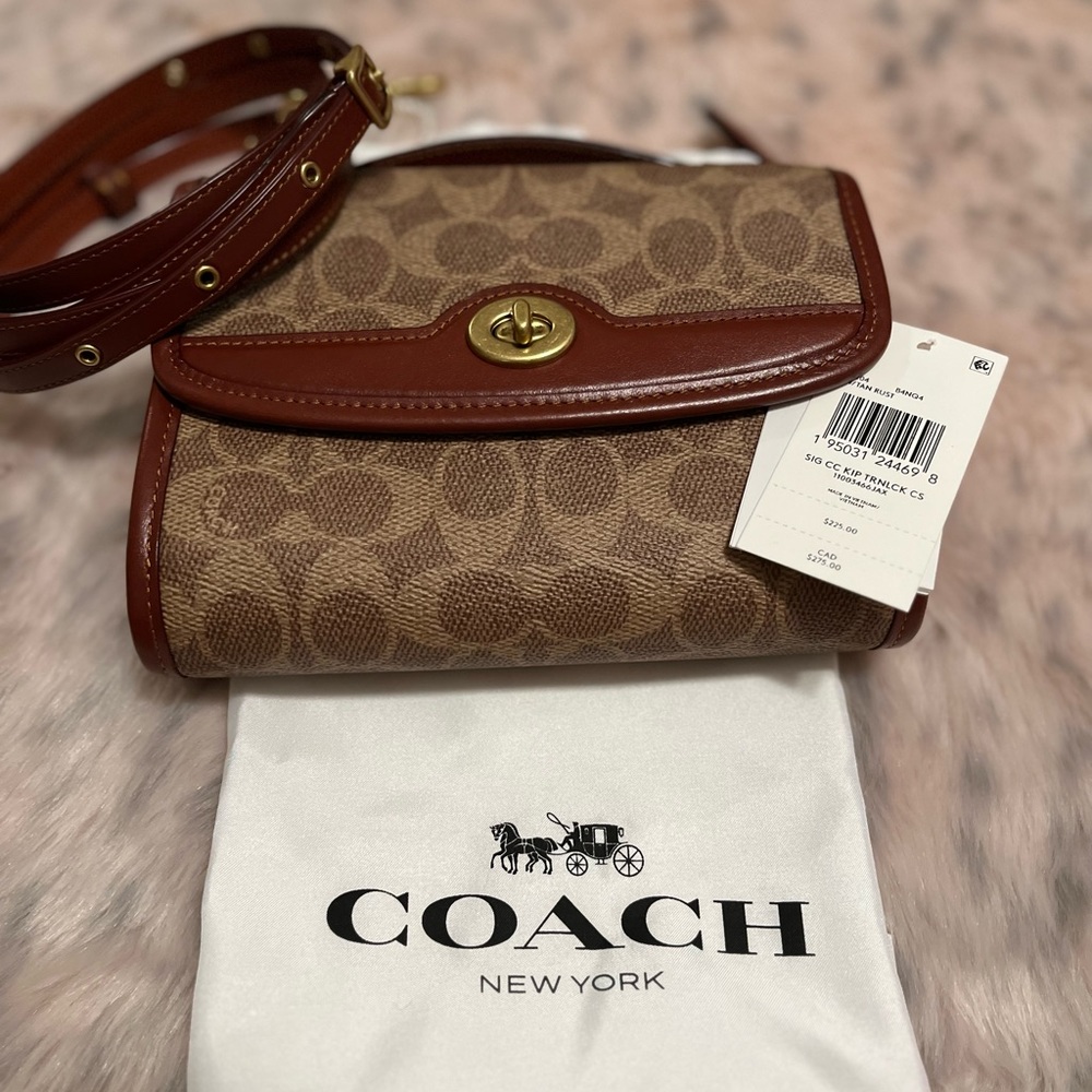 EUC. Coach Kip Turnlock crossbody.  Slight scratch on front near turnlock.